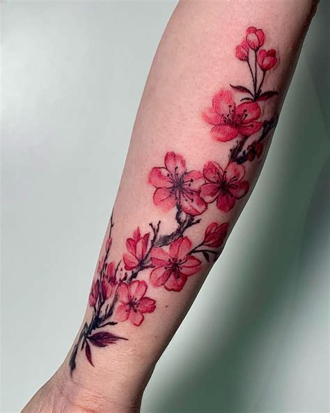 arm cherry blossom tattoo|feminine cherry blossom tattoo.